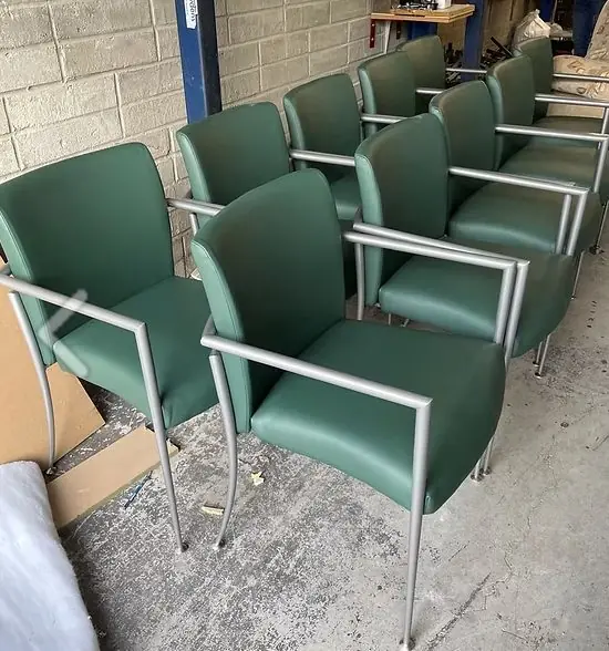 Green leather office chairs reupholstered in the James Young workshop